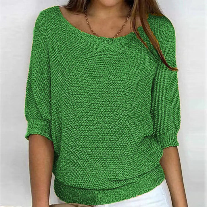 Back view of a women's relaxed-fit batwing-sleeve comfort sweater. Versatile casual top.