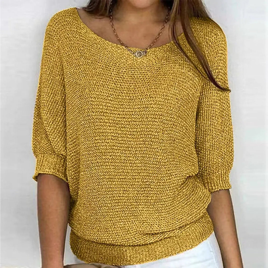 Close-up of the fabric & batwing sleeve detail on a women's relaxed-fit comfort sweater.