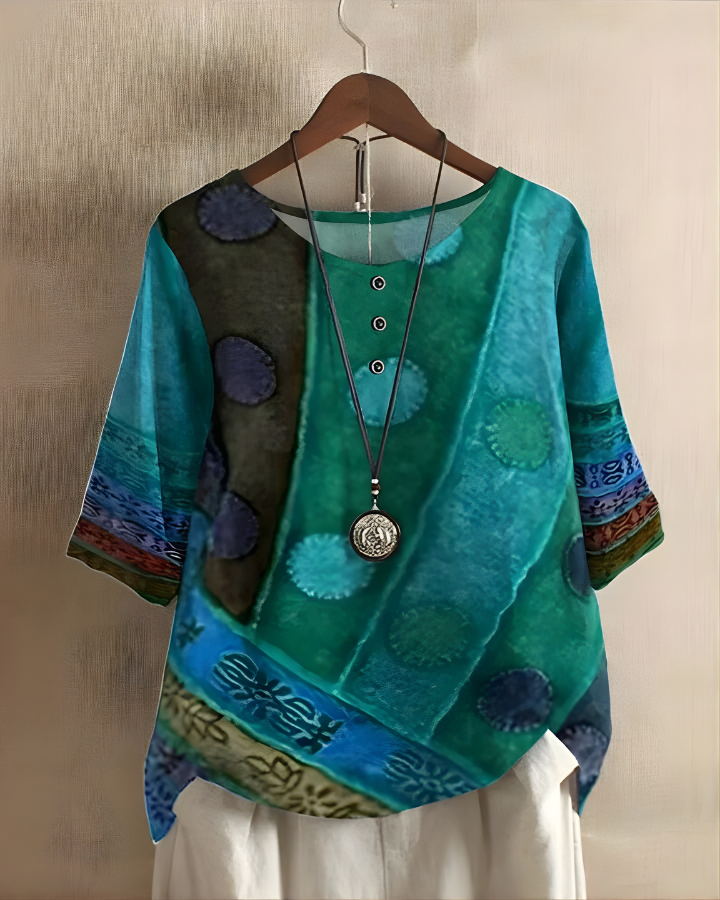 Bohemian style women's summer top, relaxed fit, with a vibrant print. Perfect for casual warm weather.