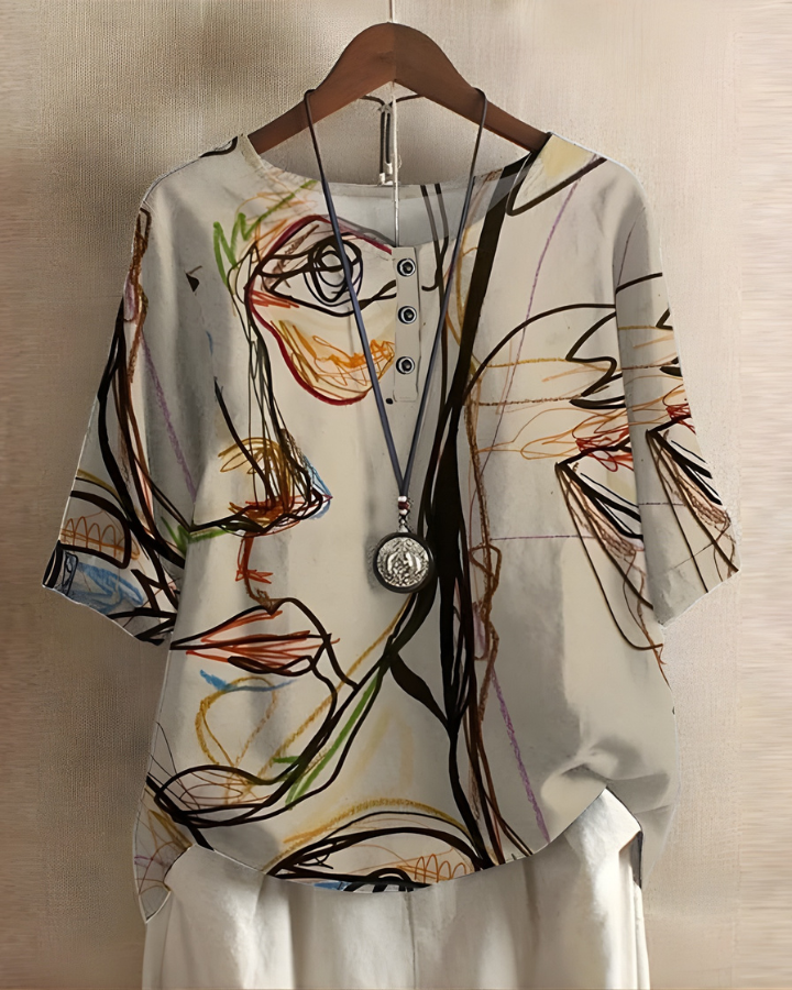 Trendy women's bohemian summer top, relaxed fit, vibrant print. Suitable for casual everyday fashion.