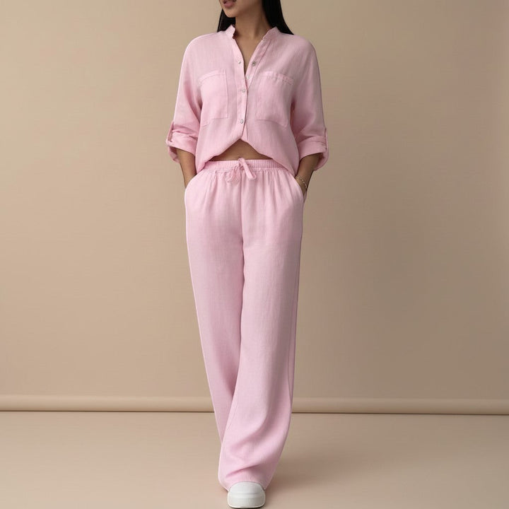 Chic women's matching set: relaxed button-down shirt and high-waisted wide-leg pants. Great for travel.