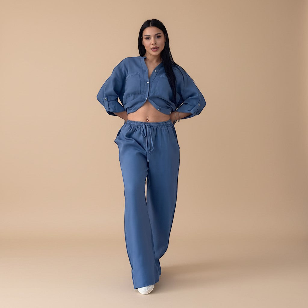 Comfortable two-piece women's set with a relaxed button-down shirt and wide-leg pants. Ideal for summer travel.