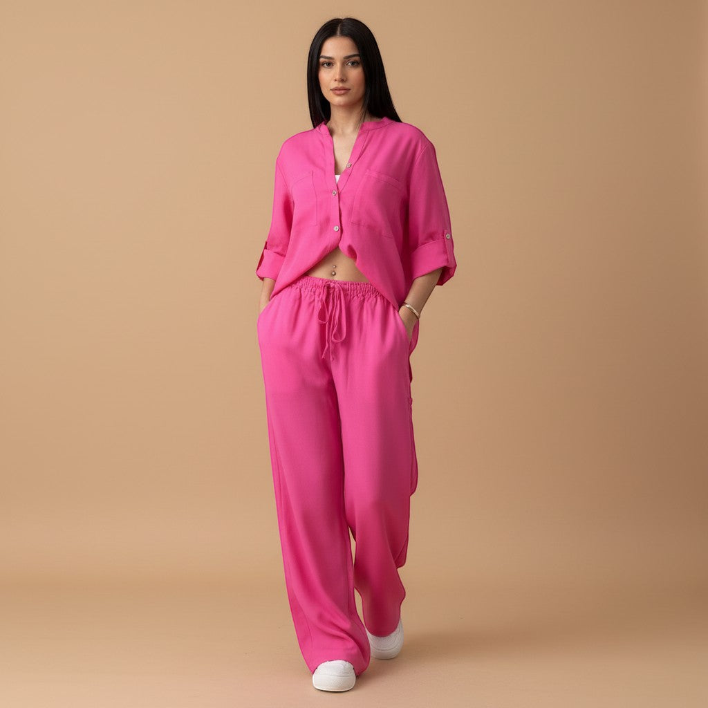 Travel-ready women's lounge wear set featuring a relaxed button-down shirt and comfortable wide-leg pants.