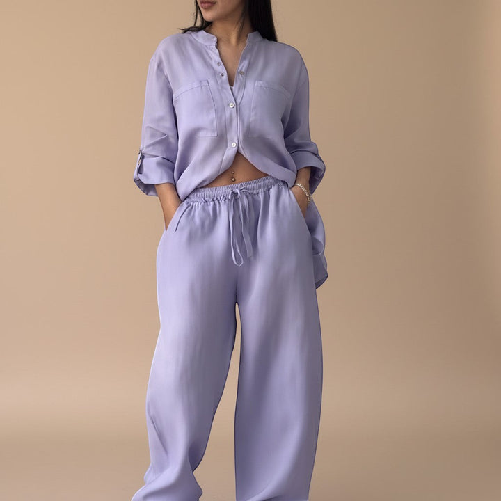 Matching two-piece women's outfit: relaxed button-down shirt & wide-leg pants. Perfect for summer casual wear.