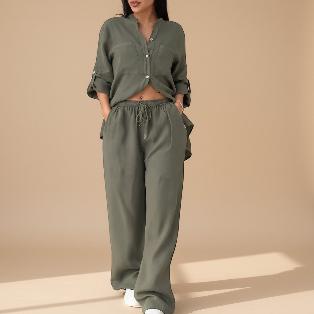 Elegant yet relaxed women's two-piece outfit: button-down shirt & wide-leg pants. Perfect for effortless style.