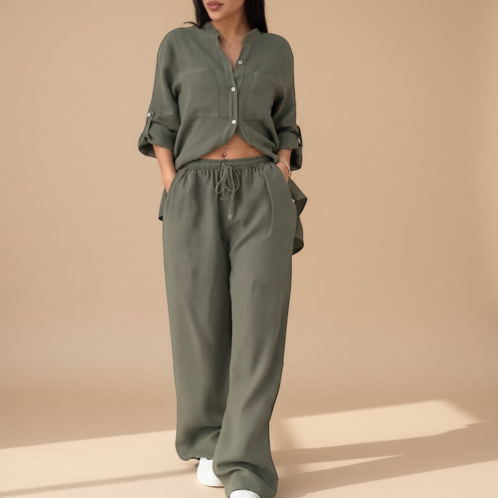 Elegant yet relaxed women's two-piece outfit: button-down shirt & wide-leg pants. Perfect for effortless style.