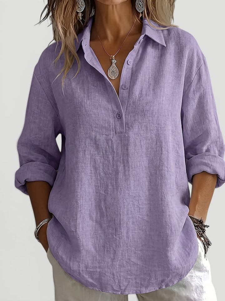 Chic women's button-up shirt, relaxed fit, long sleeve, offering a sophisticated and effortless look.