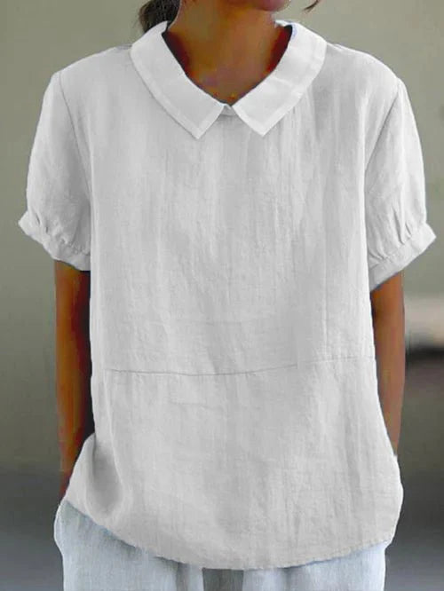 Stylish women's short-sleeve collared blouse with a relaxed fit. Perfect spring/summer top for elegant casual wear.