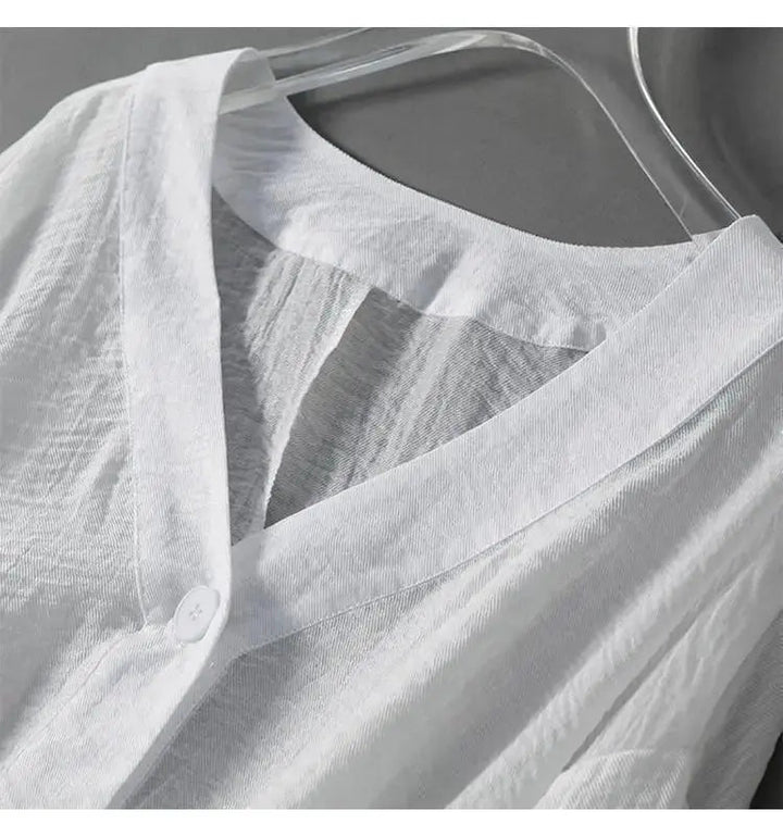 Chic loose fit women's summer blouse, cotton linen, featuring elegant batwing sleeves & front buttons.