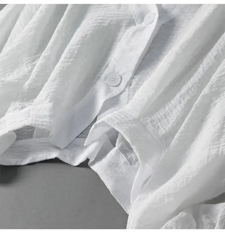 Versatile women's cotton linen top with relaxed batwing sleeves and stylish front button accents.