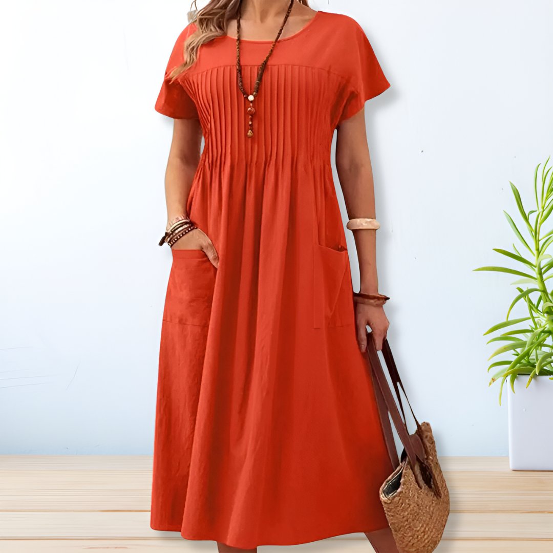 Blue relaxed fit day dress for women, with tummy control and convenient pockets. Ideal comfortable summer dress.