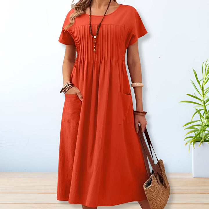 Blue relaxed fit day dress for women, with tummy control and convenient pockets. Ideal comfortable summer dress.