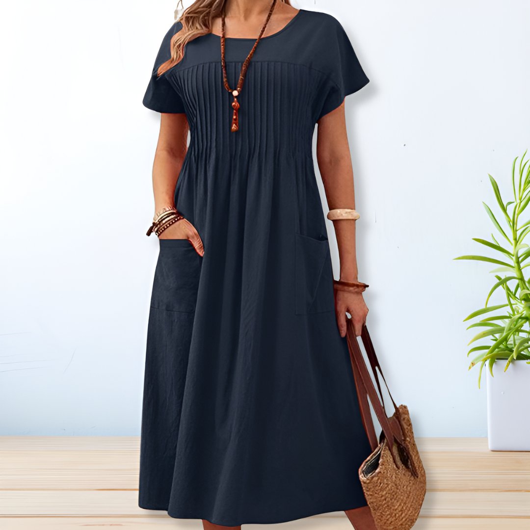 Green relaxed fit women's day dress, offers tummy coverage & comfort. Versatile short sleeve casual dress.