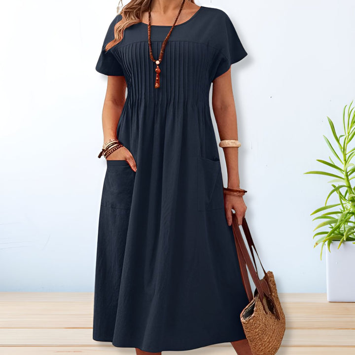 Green relaxed fit women's day dress, offers tummy coverage & comfort. Versatile short sleeve casual dress.