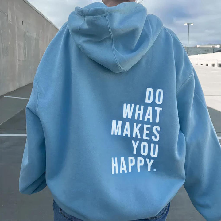Cozy women's relaxed fit hoodie featuring thumb holes and a practical kangaroo pocket for everyday comfort.