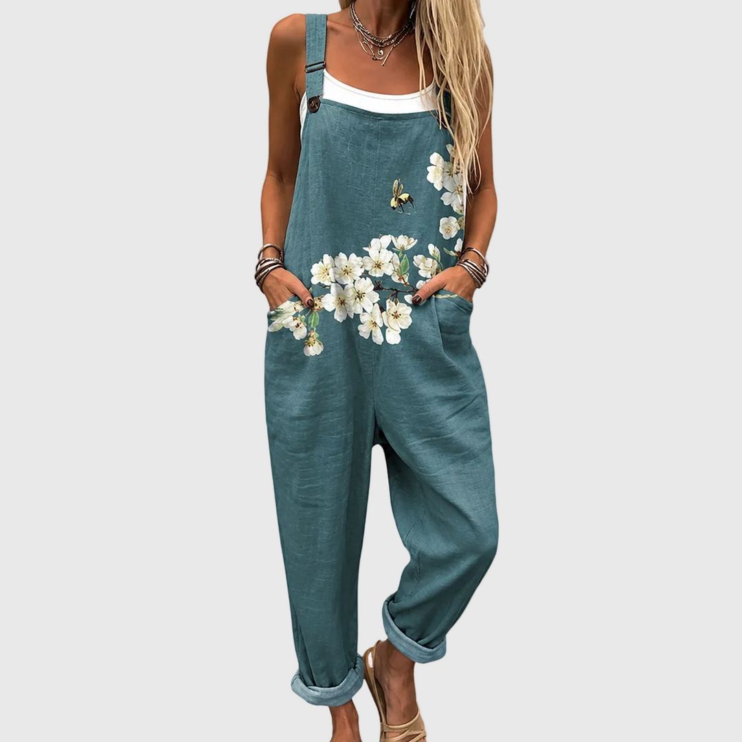 Women's relaxed fit floral garden overall in petrol green with adjustable straps, perfect for casual summer wear.