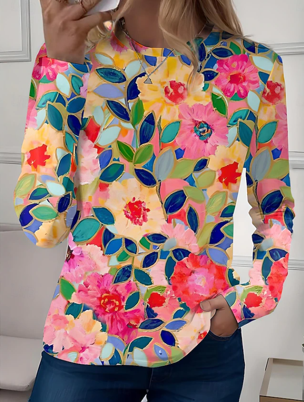 Multicolour floral print long sleeve casual shirt for women. Relaxed crew neck top in blue, green, and purple tones.