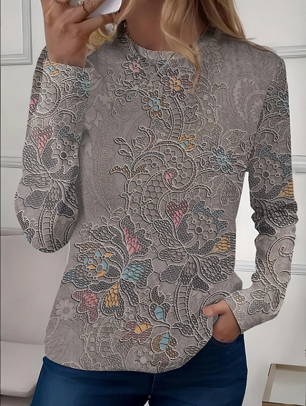 Green floral print women's long sleeve casual top. Relaxed crew neck blouse, ideal for comfortable everyday style.