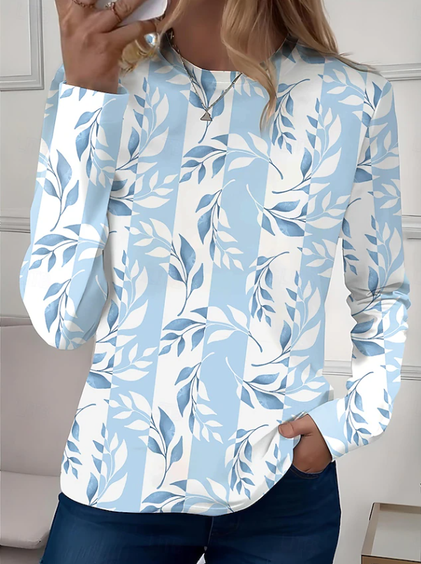 Comfortable women's long sleeve floral crew neck shirt. Relaxed fit blouse, perfect for stylish casual everyday wear.