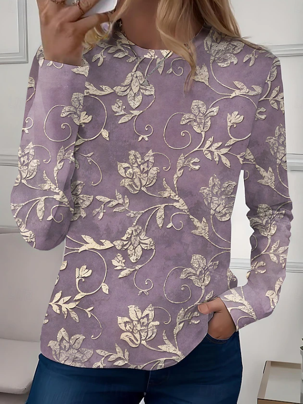 Light blue floral women's casual long sleeve shirt. Relaxed fit crew neck blouse with vibrant feminine print.
