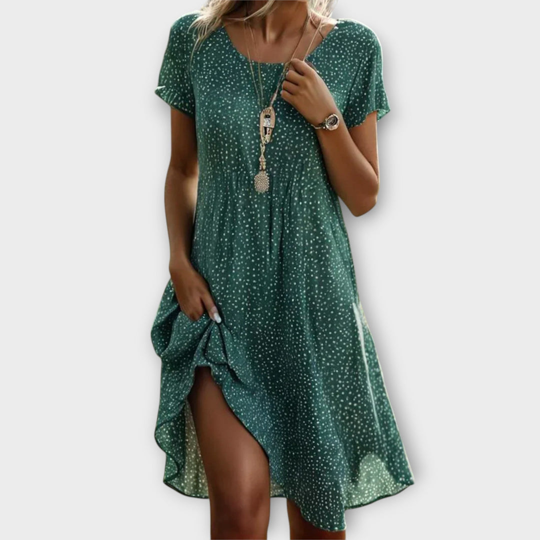 Women's relaxed fit flowy polka dot midi dress, an elegant A-line summer dress for casual or dressy occasions.