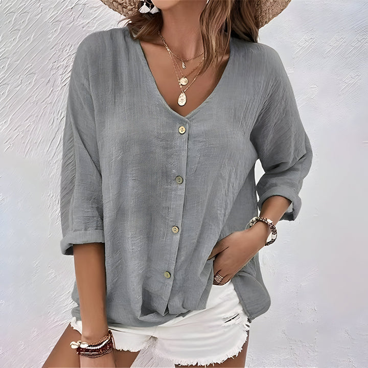 Khaki women's button-up blouse, a versatile relaxed fit top for smart casual and everyday wear.