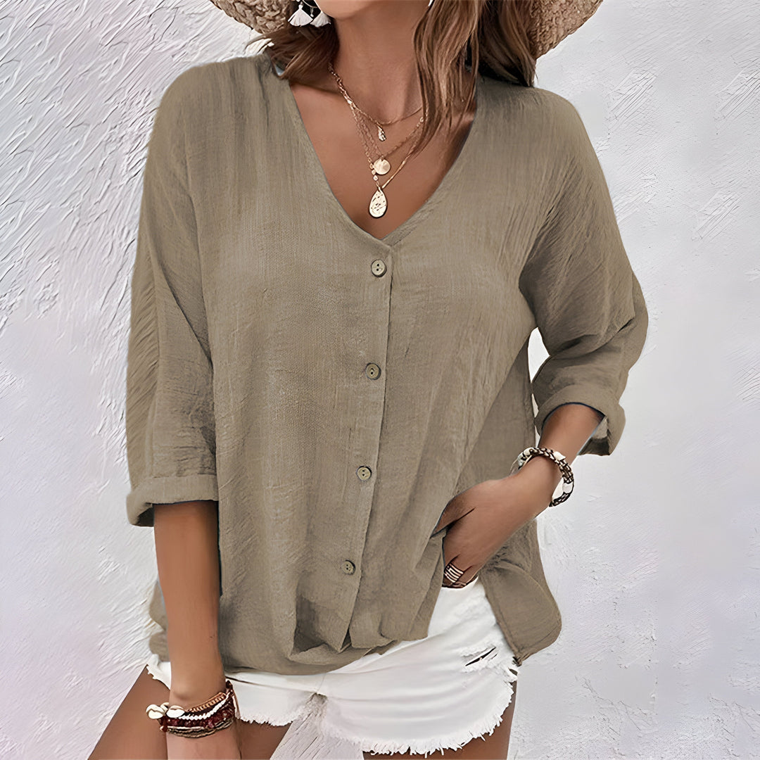 Effortless women's relaxed button-up blouse, a long sleeve top for casual elegant and smart casual looks.