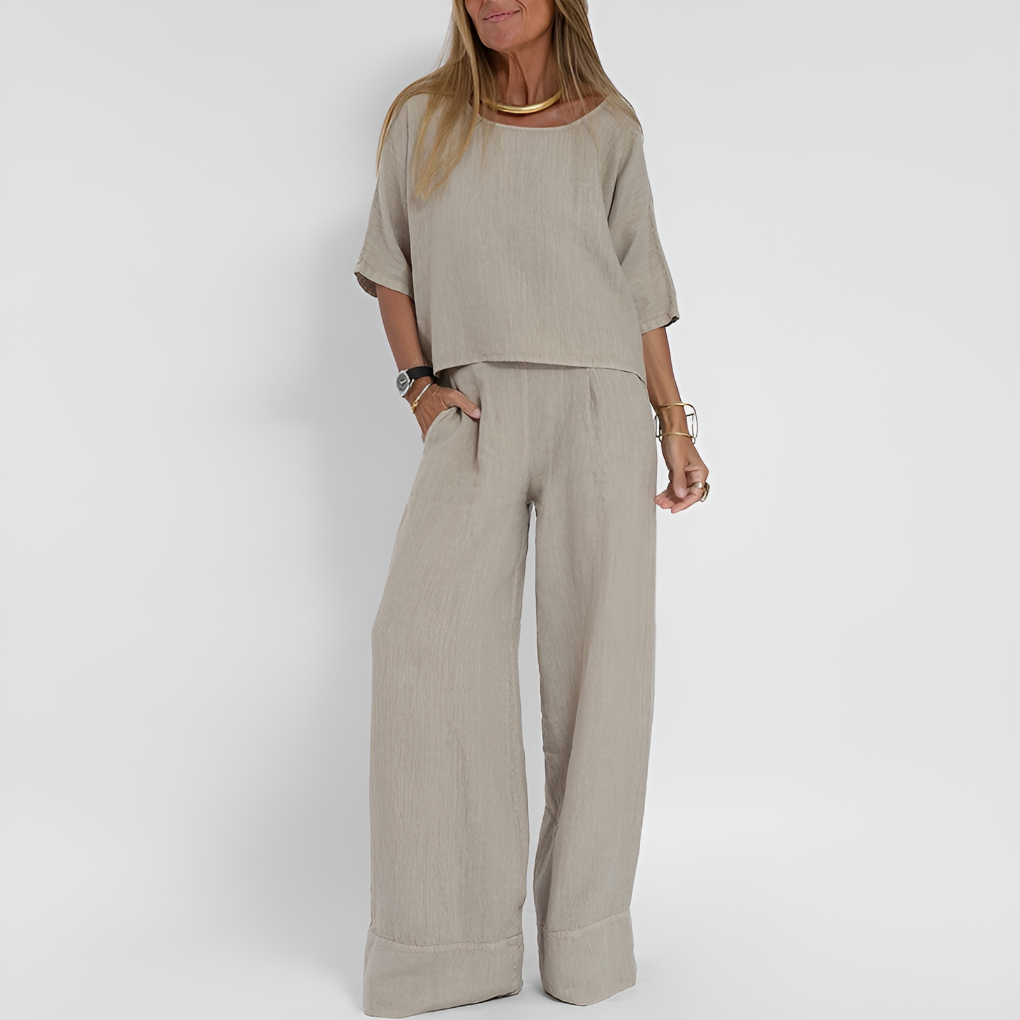 Women's relaxed fit linen blend two-piece set featuring a button-down top and wide-leg pants. Perfect for summer.