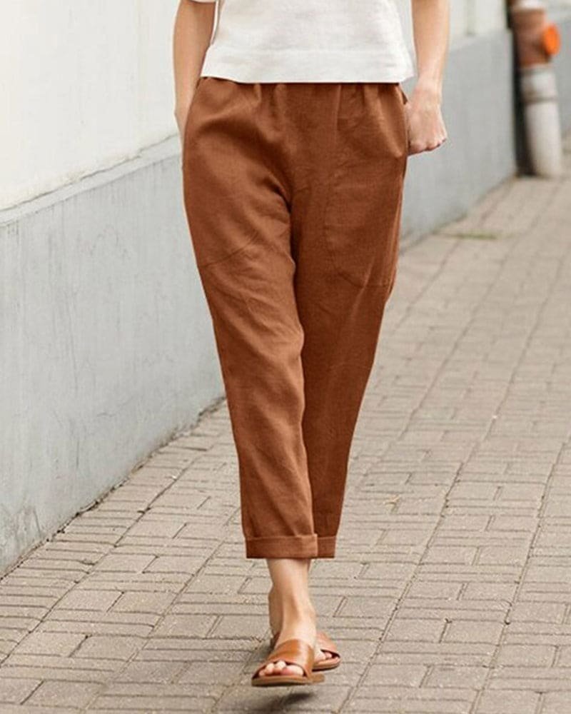 Women's tapered linen pants with cotton blend for summer. Relaxed fit, breathable fabric, and elastic waistband.