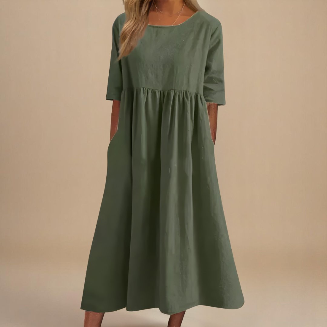 Women's relaxed fit linen midi dress with half-sleeves & gathered waist, perfect for casual summer elegance.