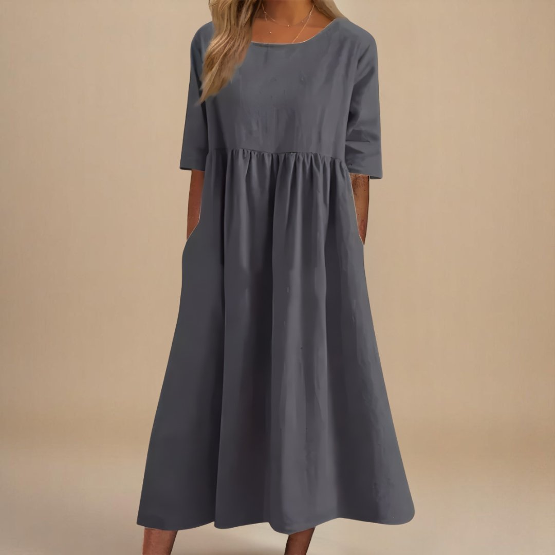 Comfortable women's relaxed fit linen midi dress, featuring half-sleeves and a flattering gathered waist.