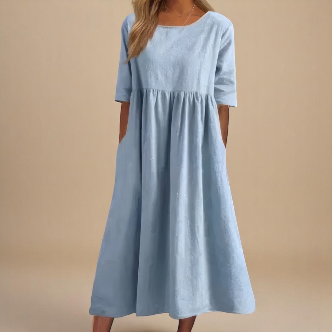 Lightweight linen midi dress for women. Relaxed fit, half-sleeves, and gathered waist offer comfort & casual style.