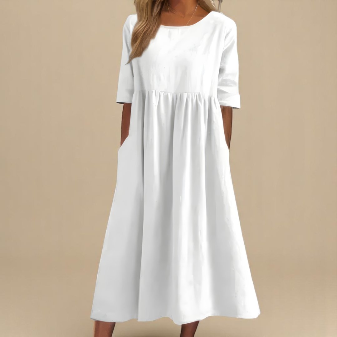Relaxed fit women's midi dress in linen, featuring chic half-sleeves and a flattering gathered waist for spring/summer.