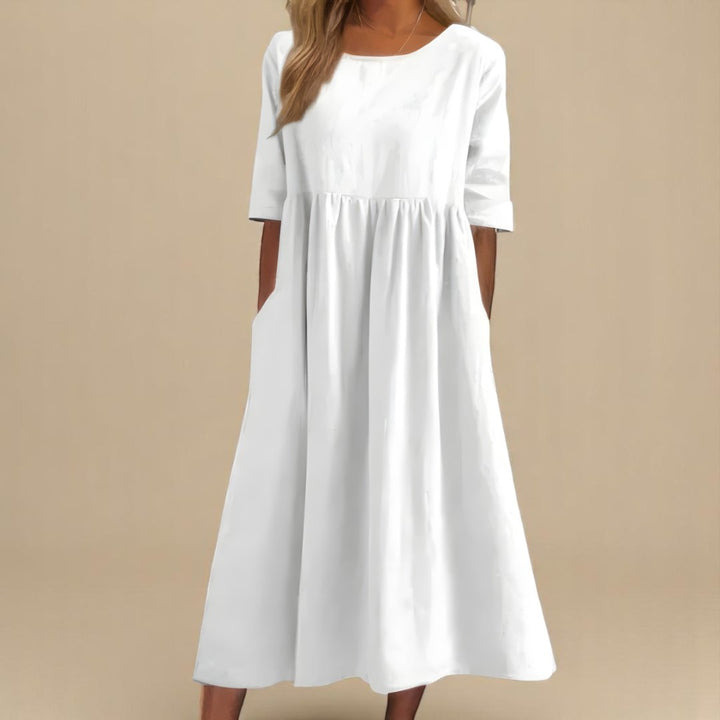 Relaxed fit women's midi dress in linen, featuring chic half-sleeves and a flattering gathered waist for spring/summer.