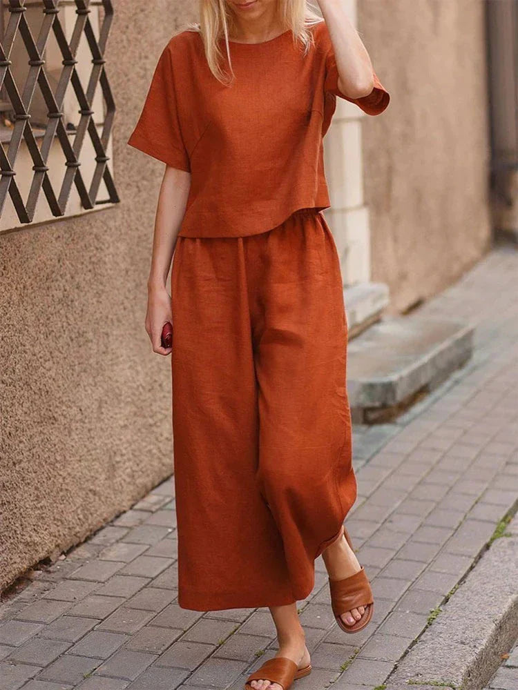 Women's relaxed fit linen two-piece set, perfect for casual summer wear. Includes a crew neck top & wide leg trousers.