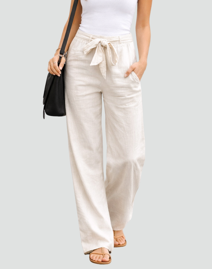 Comfortable women's linen wide leg pants, featuring a relaxed fit & adjustable drawstring waist for casual summer days.