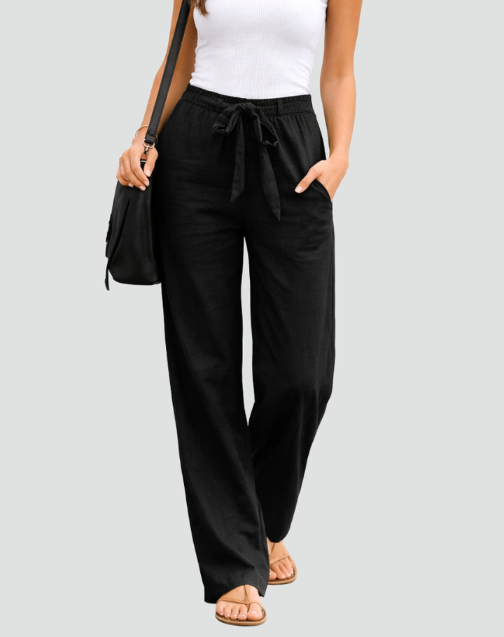 Soft women's linen wide leg trousers, designed with a relaxed fit & practical drawstring waist for ultimate comfort.