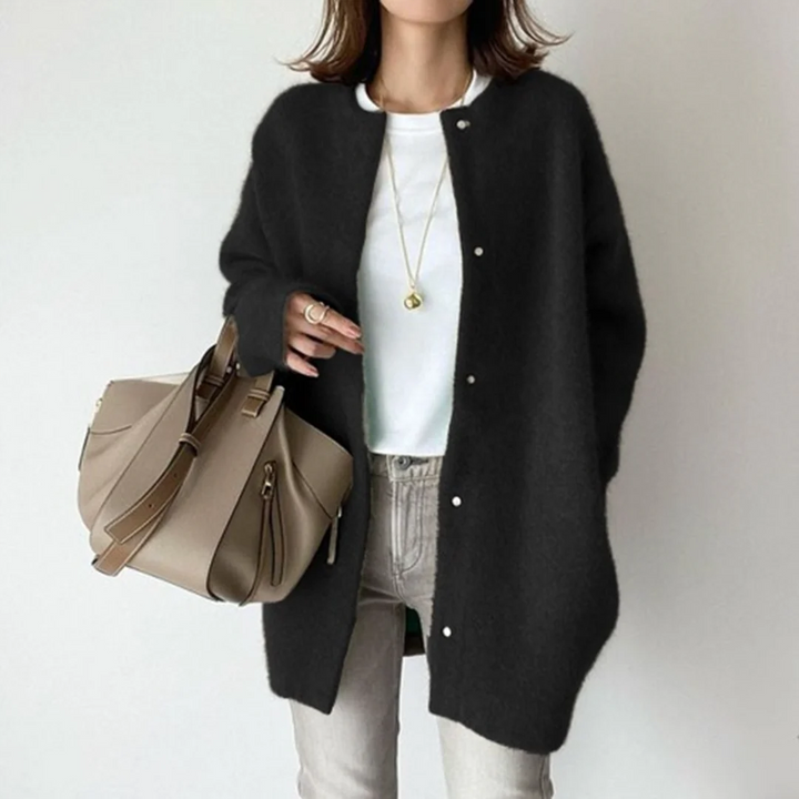 Women's button-down relaxed fit long cardigan sweater in a cozy knit, perfect for fall fashion and winter style.