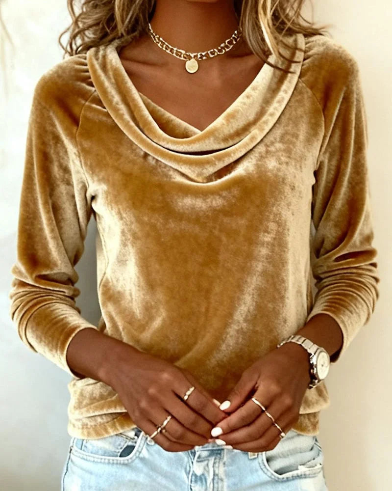 Black relaxed long sleeve top for women featuring an elegant drape neck. Comfortable and versatile fashion blouse.