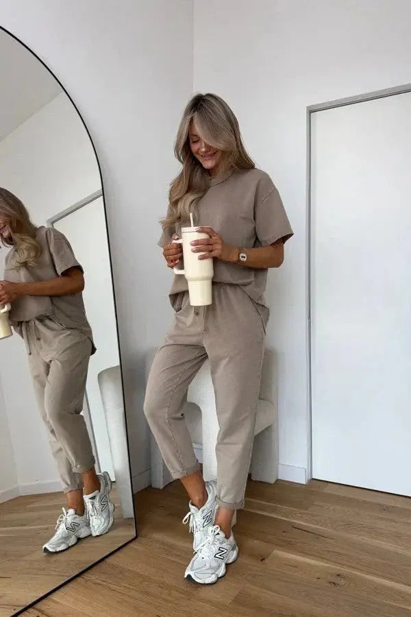 Relaxed fit women's loungewear two-piece set featuring a comfy short-sleeve top & matching pull-on shorts.