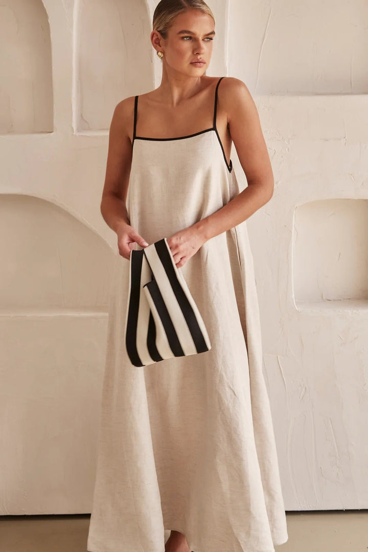 Stylish women's relaxed-fit maxi dress with adjustable straps & subtle contrast trim; perfect resort wear.
