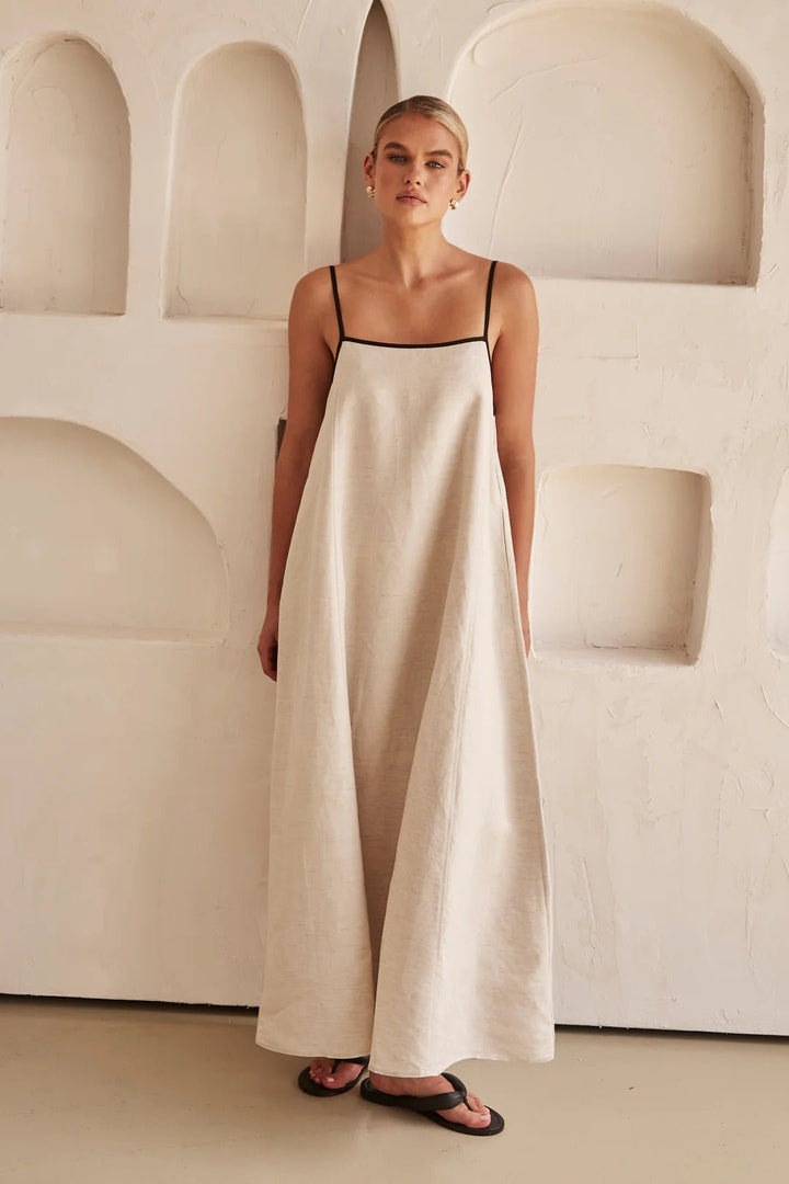 Relaxed fit women's maxi dress featuring practical side pockets and adjustable straps for ultimate comfort.