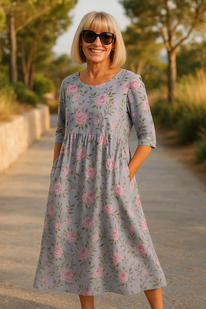 Relaxed fit women's midi dress, perfect for comfortable everyday wear or a modest summer outing.