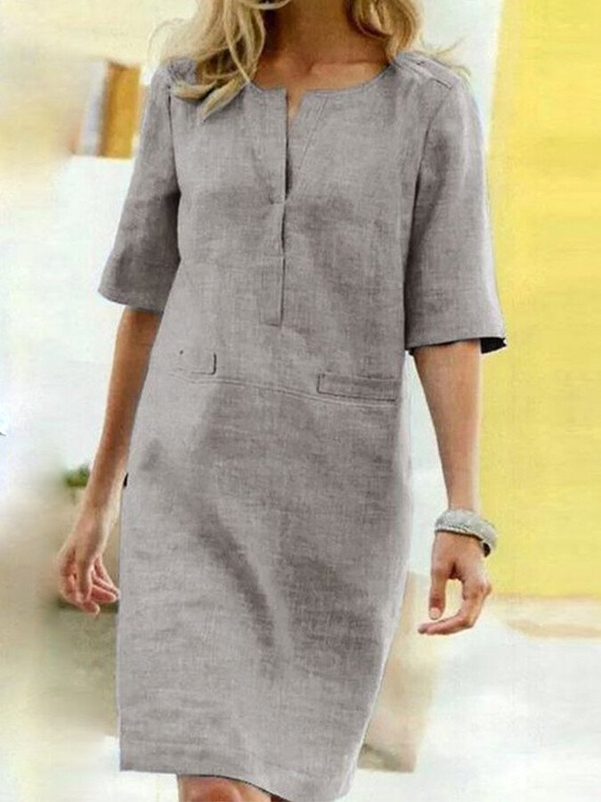 Spring/summer women's midi dress, relaxed fit, notch neck. Casual, comfortable, & versatile everyday wear.