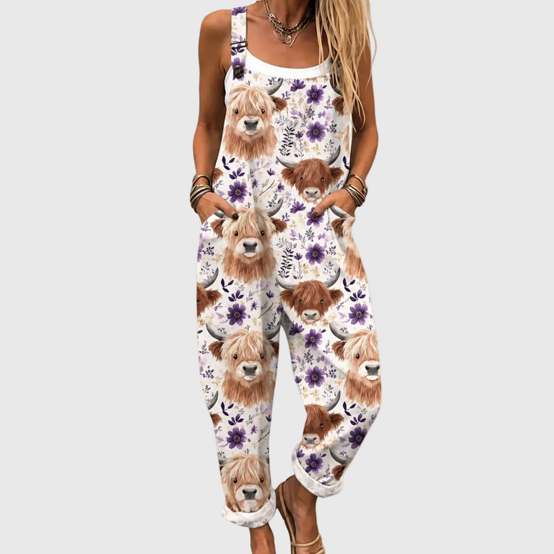 Women's relaxed fit overalls featuring a charming Highland cow and vibrant floral print for a casual country summer look.