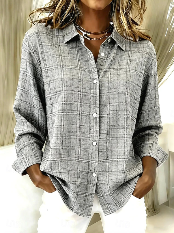 Comfortable women's oversized plaid button-up shirt, casual long sleeve top for effortless weekend style.