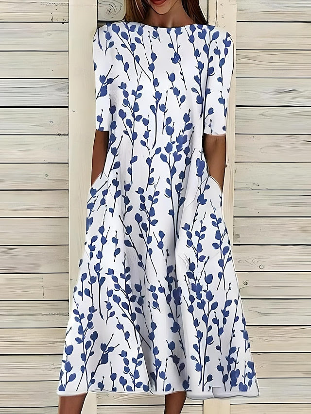 Women's relaxed fit printed midi dress with short sleeves & round neck. Perfect for casual summer elegance & everyday style.