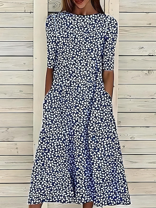 Stylish women's printed midi dress featuring a relaxed fit, short sleeves & round neck. Effortless everyday summer fashion.