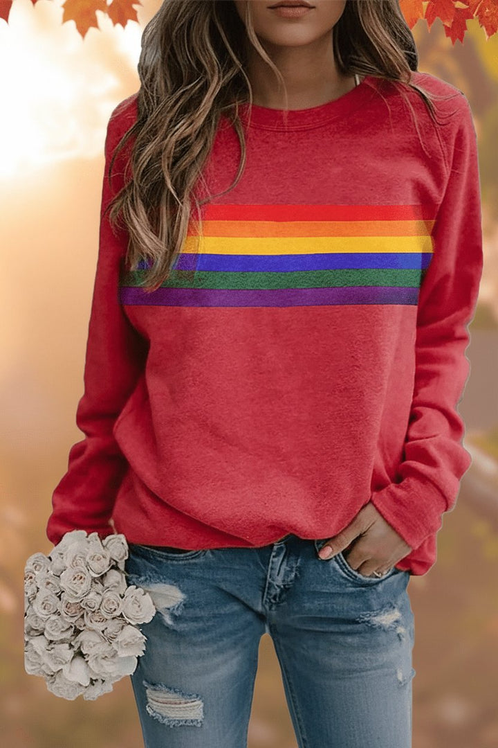 Women's relaxed-fit rainbow striped crew-neck jumper for casual wear.