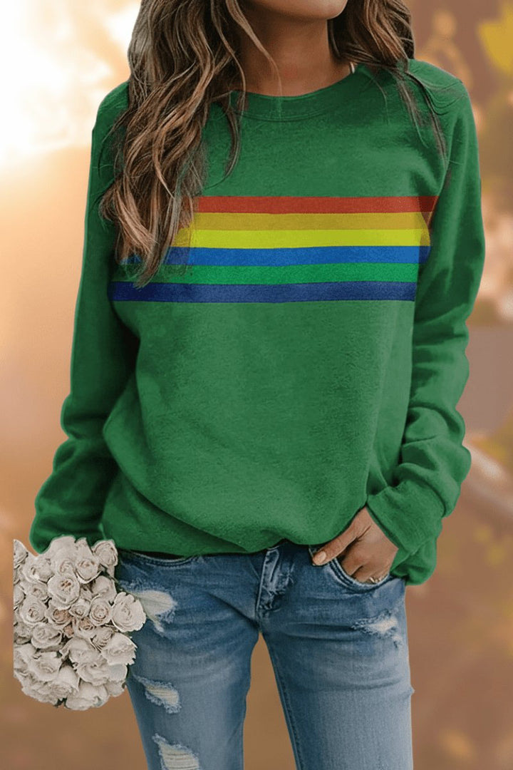 Comfortable women's rainbow stripe relaxed-fit crew-neck jumper. Vibrant casual top.